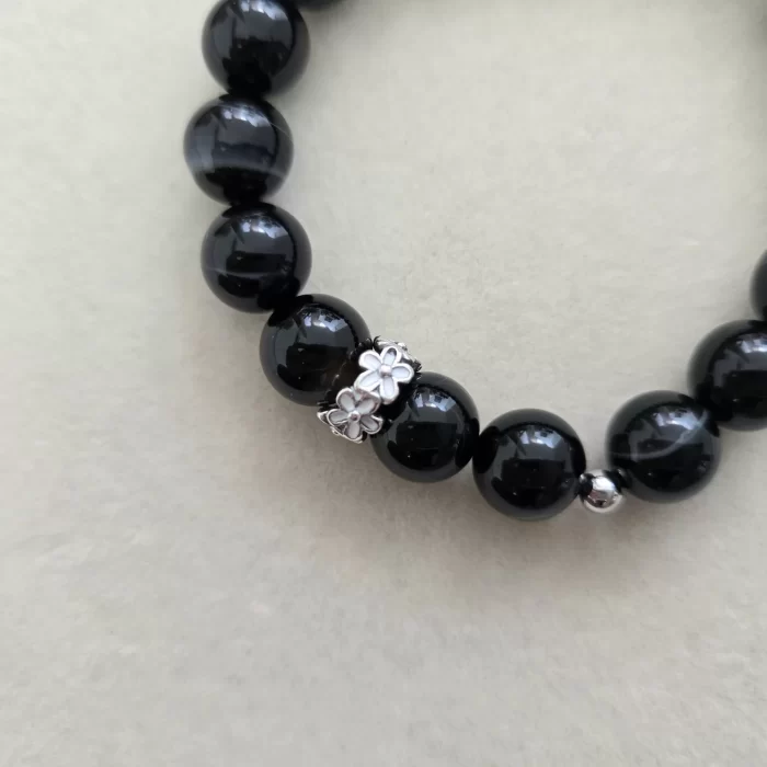 20250509_100118 Black Botswana Agate Bracelet with Flower Charm - Image 5