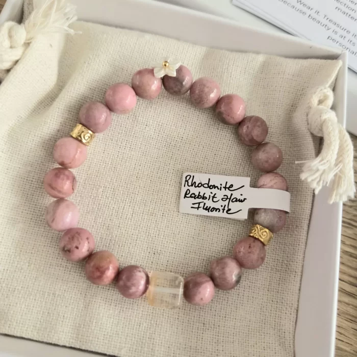 20250514_093137 Rhodonite Bracelet with Rabbit Hair Fluorite Spacer & Flower Charm - Image 5