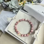 Rhodonite Bracelet with Rabbit Hair Fluorite Spacer & Flower Charm - Image 2